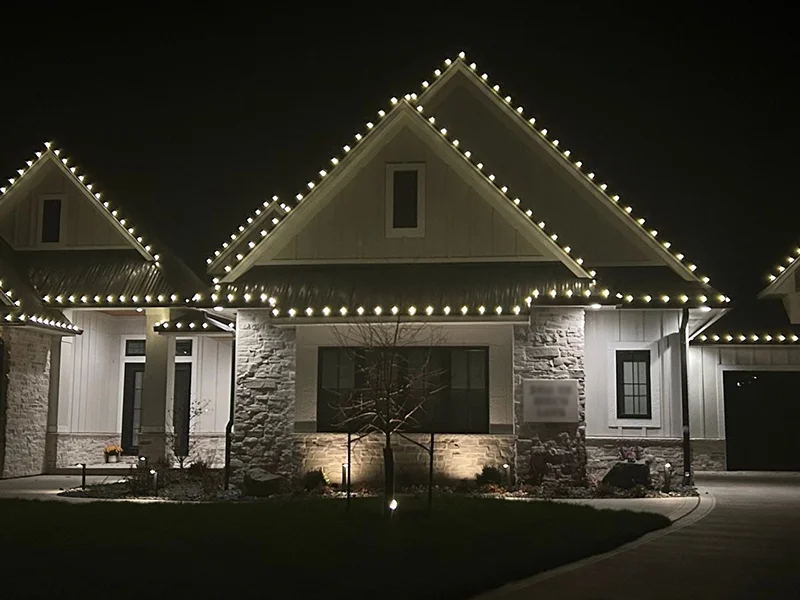 Home exterior with white lighting